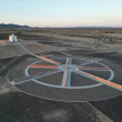 In this drone aerial photo the granite panels engraved with the History of Humanity and The Church on the Hill are seen in the town of Felicity, home of The Museum of History in Granite,  on April 11, 2023. - The tiny town of Felicity, which borders Yuma, Arizona and Mexico, was founded by French-American Jacques-Andre Istel, 94, and is the home of Istel’s passion project, the Museum of History in Granite. Istel’s Sonoran Desert town also enjoy the whimsical distinction of being the “Center of the World” thanks to it’s official recognition as such on the behalf of both California’s Imperial County and France’s Institut Geographique National. (Photo by Robyn BECK / AFP)