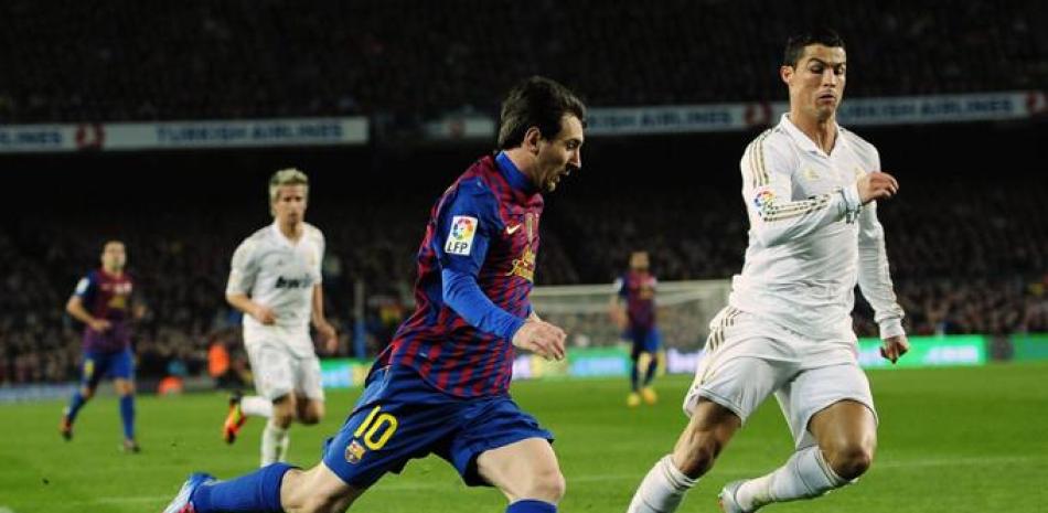 Lionel Messi y Cristiano Ronaldo aparecen en un encuentro pasado entre Real Madrid y Barcelona.